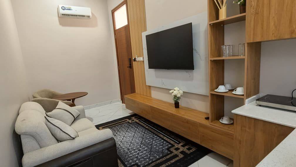 The VIP Suite living area, with a sofa and television