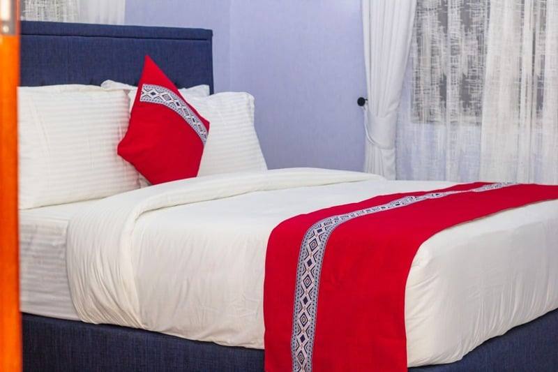 Bedding detail, crisp cotton with a woven runner